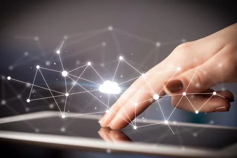Fingers touching tablet with cloud concept Foto stock
