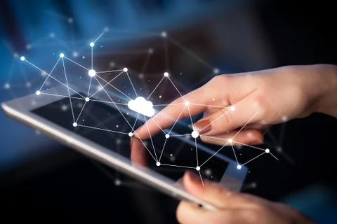 Fingers touching tablet with cloud concept Foto stock