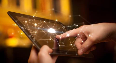 Fingers touching tablet with cloud concept Foto stock