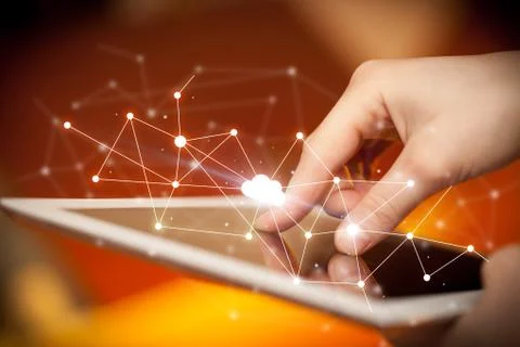 Fingers touching tablet with cloud concept Foto stock