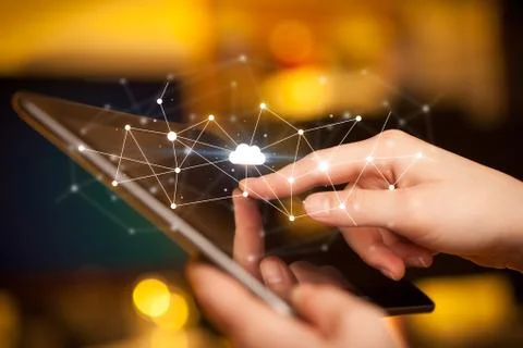 Fingers touching tablet with cloud concept Foto stock
