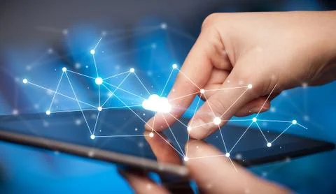 Fingers touching tablet with cloud concept Foto stock