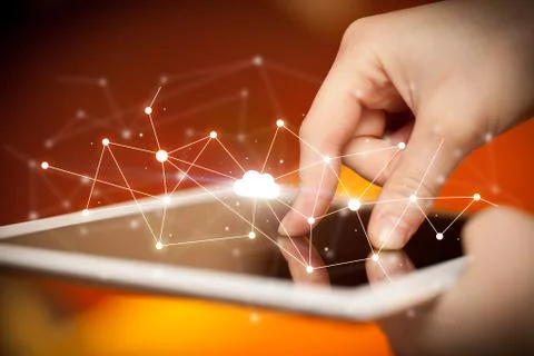 Fingers touching tablet with cloud concept Foto stock
