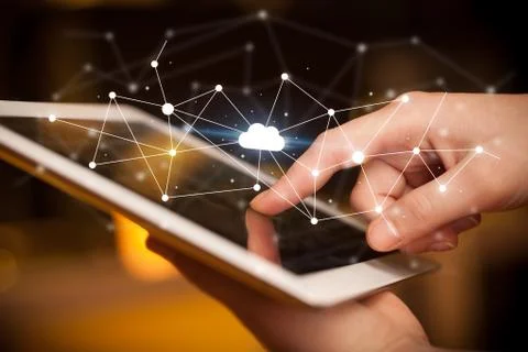 Fingers touching tablet with cloud concept Foto stock