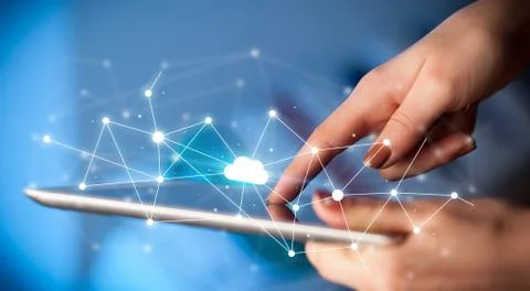 Fingers touching tablet with cloud concept Foto stock