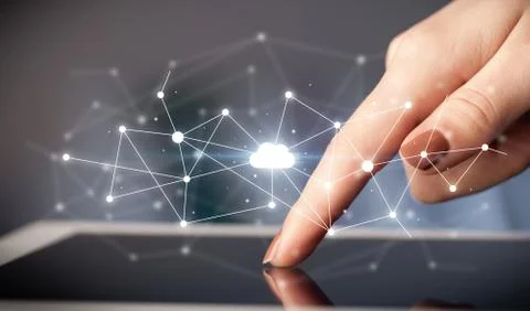 Fingers touching tablet with cloud concept Foto stock