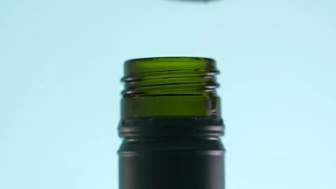 Fingers twist a cap onto a bottle. Stock Footage 265247101