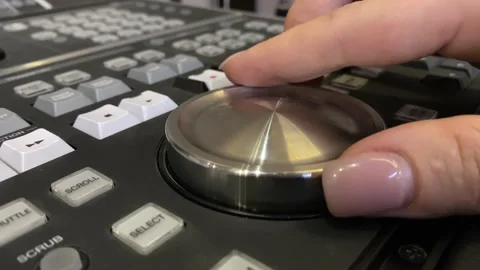 Fingers twist the sound control panel Stock Footage 221757555