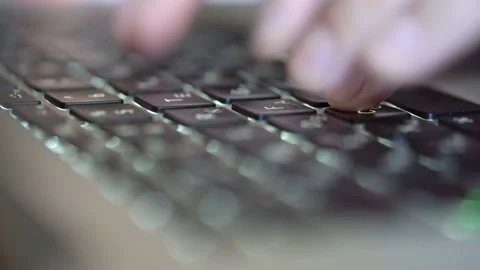 Fingers type on the keyboard, shallow depth of field, macro Stock Footage 194690834