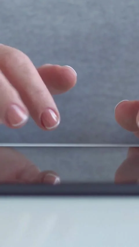Fingers typing and scrolling on digital tablet screen closeup Video stock 334168694