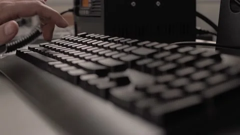 Fingers typing on the black computer keyboard. Stock Footage 212392320