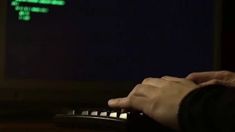 Fingers typing computer code. Hacker tries to get access Stock Footage 71317831