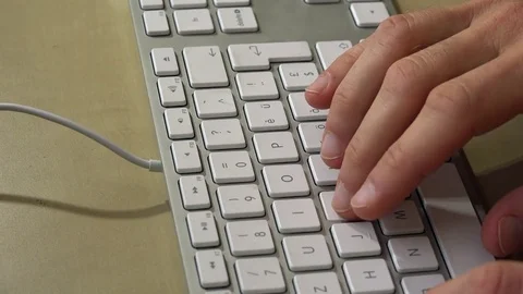 Fingers typing on computer keyboard and pressing the "enter" button Stock Footage 71820951