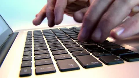 Fingers typing fast on keyboard Stockbeeldmateriaal 10858800