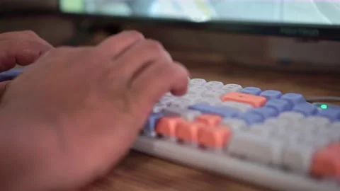 Fingers typing fast on RGB mechanical keyboard, close-up shot. Stock Footage 342633754