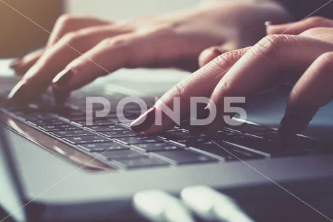 Fingers typing on the keyboard Stock Photos