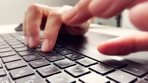 Fingers typing on a laptop keyboard, close-up Stock-Footage 336560015