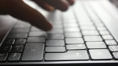 Fingers typing on a laptop keyboard Stock Footage