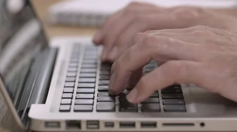 Fingers typing on a silver laptop Stock Footage 68446848