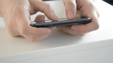 Fingers typing on smartphone Stock Footage 33844906