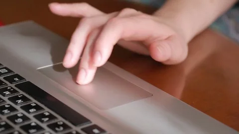 Fingers working on a laptop touchpad, close-up Stock Footage 72962789