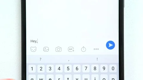 Fingers write on screen of mobile phone message to interlocutor "Hey, what's up" Stockbeeldmateriaal 248028851