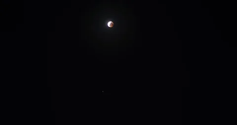 Finish of the moon eclipse and blood moon in Tbilisi Georgia July 2018 Stock Footage 93036179