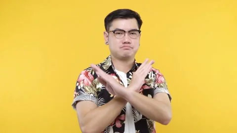  Finish, no way! Guy in aloha shirt demanding to stop, crossing hands showing x  Stock Footage 144666792