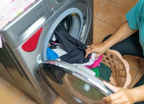 Finish process of washing machine takes the laundry out. Stock Photos