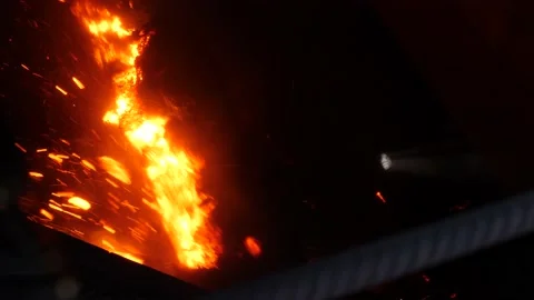 The finished agglomerate falls onto the crushers. Stock Footage 139693150