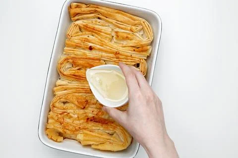 Finished Crinkle Cake made from phyllo dough glazed with sugar syrup Stock Photos