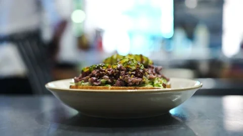 The finished dish is on the waiter's counter before serving it to the client Stock Footage 141323172