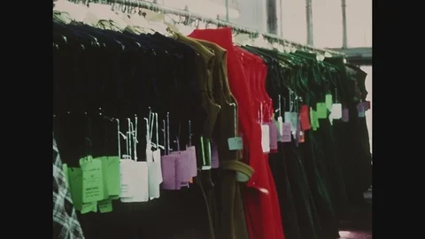 Finished dresses on a rack at Abe Schrader, fashion district, 1971 Video stock 82521398