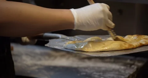 Finished Flatbread Seasoned and Brushed with Olive Oil Video stock 129848612