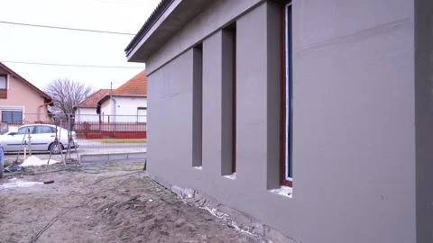 Finished insulation facade shows clean surface and evenly aligned window frames Stock Footage 312444571