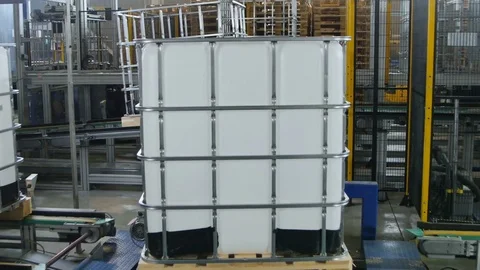 Finished Intermediate Bulk Container Rotates on Pallet Stock Footage 79625603