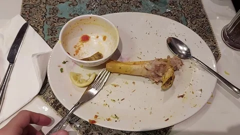 Finished Meal Plate: Lamb Bone, Lemon, Empty Bowl, Aftermath, Food Shot Stock Footage 304816253