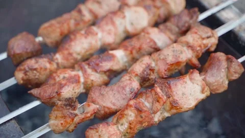 The finished meat with a crust is cooked over the heat of the grill and smoke. Stock Footage 310168994