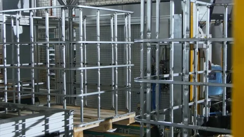 Finished Metal Carcasses Transported by Conveyor Past Camera Stock Footage