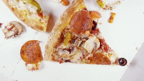 Finished pizza in a cardboard box rotates in a circle top view Stock Footage 101018803