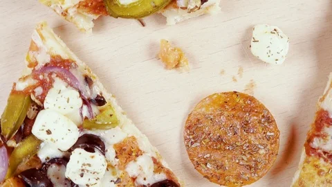 Finished pizza in a cardboard box rotates in a circle top view Stock-Footage 101019086