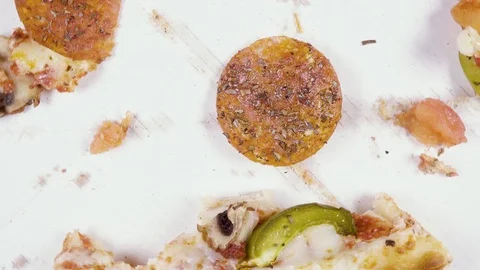 Finished pizza in a cardboard box rotates in a circle top view Stock Footage 101019563