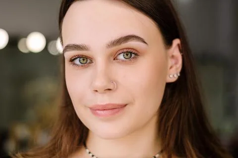 Finished result after dyeing eyebrows brunette woman with green eyes looking Stock Photos