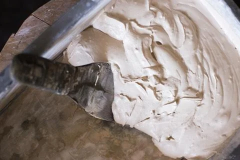 Finished solution of the final putty in a plastic container, repair work Stock Photos