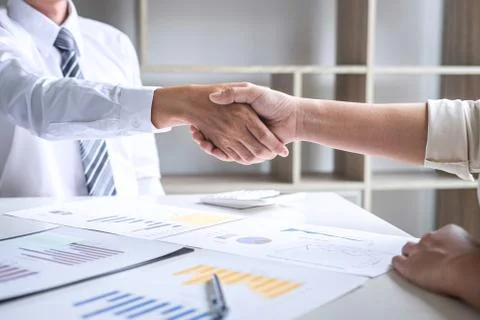 Finishing up a conversation after collaboration, handshake of two business pe Stock Photos