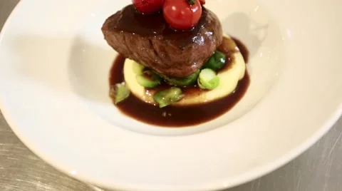 Finishing off a dish with beef Stock Footage 60443048