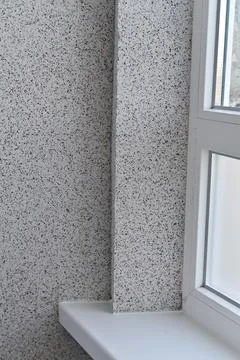 Finishing of the plastic window and window sill in the interior of the apar.. Stock Photos