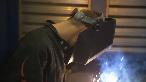 Finishing a Weld at Tech School Stock Footage 124399846