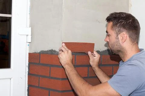 Finishing work on the new facade. Stock Photos