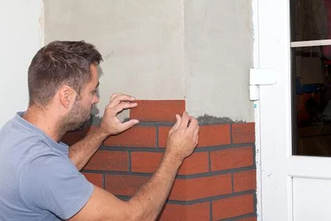Finishing work on the new facade. Stock Photos